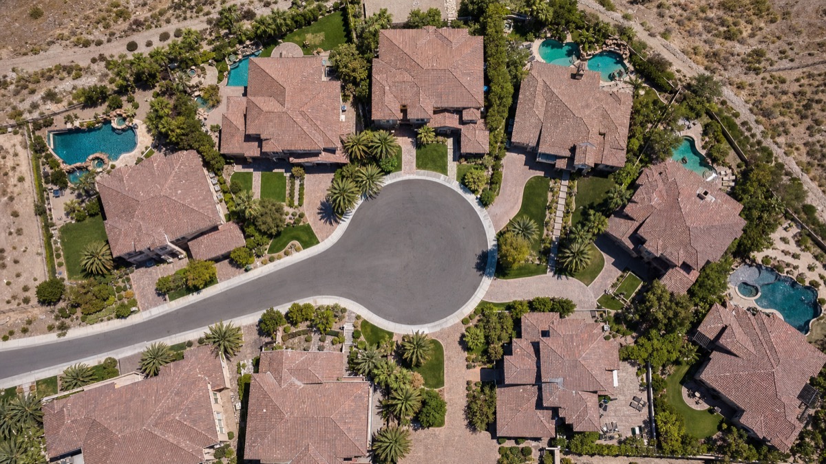 Typical Henderson Nevada single-family cul-de-sac neighborhood with tile-roof homes and desert landscaping